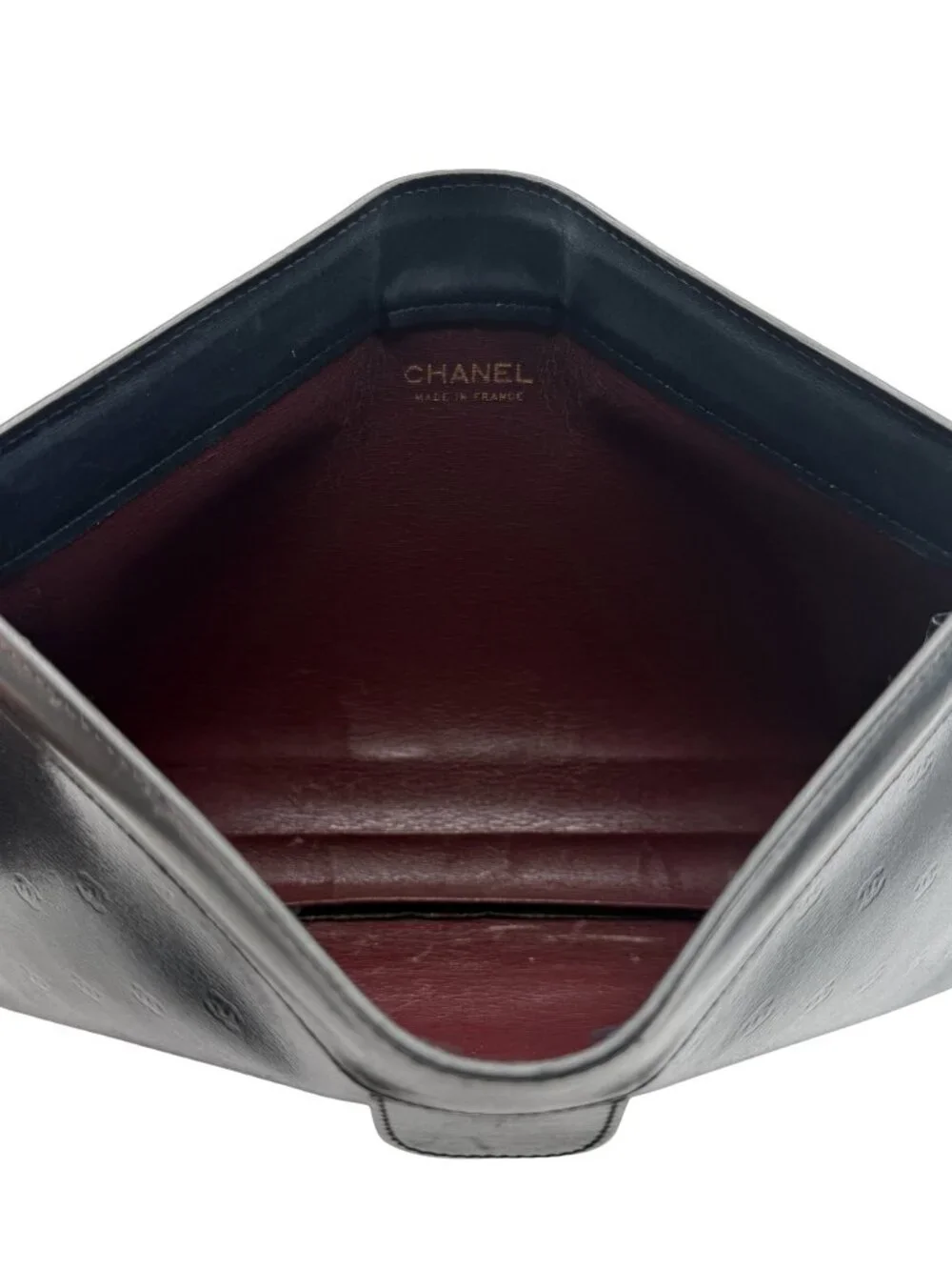 Vintage CHANEL Lambskin Leather Clutch with Mini Embossed CC Logos